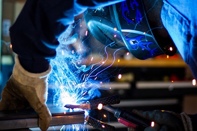 image of welder working in manufacturing plant