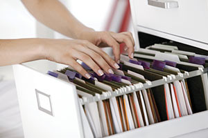 image of filing cabinet with insurance certificates filed