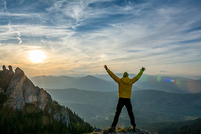 image of man on top of mountain