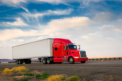 image of commercial truck driving through illinois