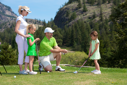 family golfing