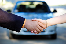 shaking hands with car