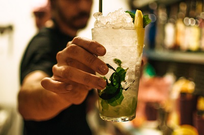 image of man serving alcohol in restaurant