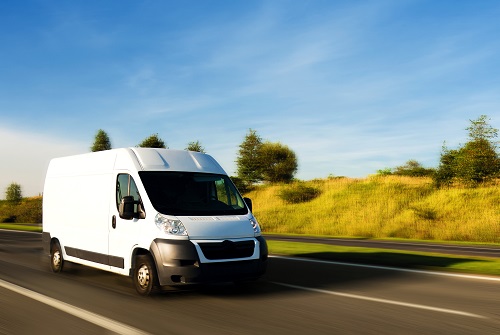 commercial car driving on road